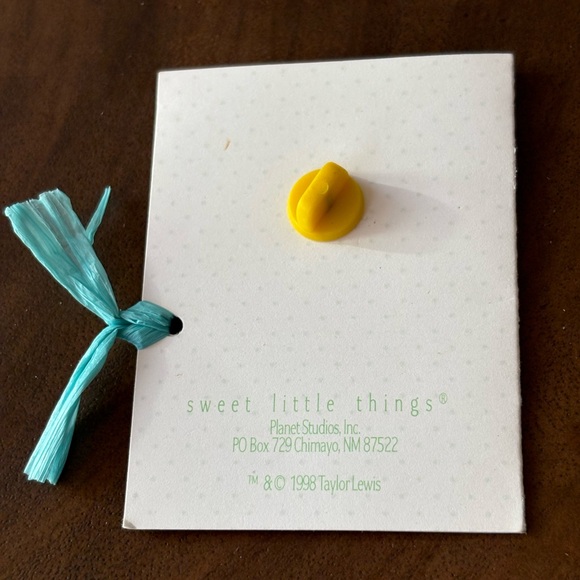 Tiny little bunny pin with pink ears, a blue bow, and white “heart” cottontail - Picture 7 of 12